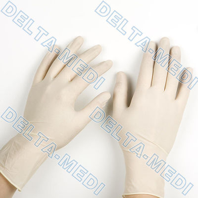 L doigt de taille a donné à des gants une consistance rugueuse d'examen de latex pour le laboratoire